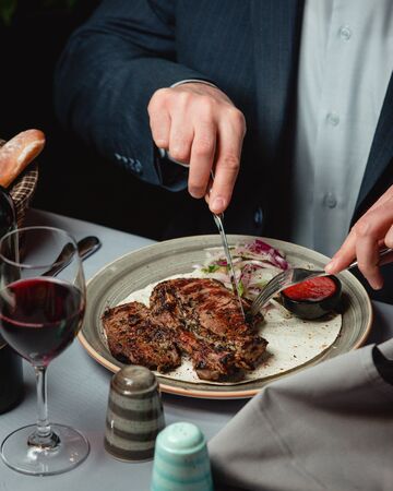 delicious steak with spicy sauceの写真素材