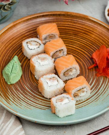 fish sushi on a circular plateの写真素材