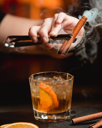 whiskey with lemon and cinnamonの写真素材