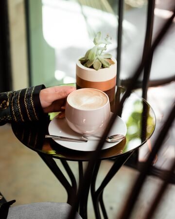 Cup of hot cappuccino with a patternの写真素材