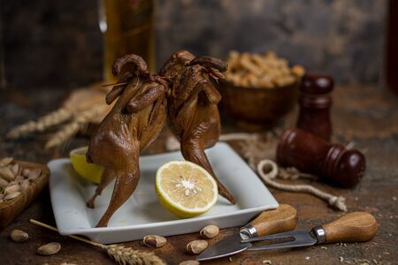 Two fried quailes in front of each other