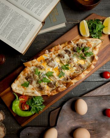 Turkish pide with meat and eggsの写真素材
