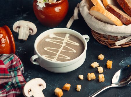 Creamy mushroom soup served with bread
