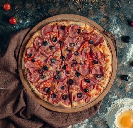 Mix pizza with italian sausage salsiccia, tomato, olive and cheeseの写真素材