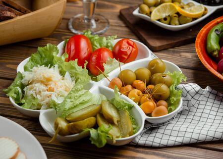 Pickled plate of cucumber, tomato, cabbage, greengage, mini applesの写真素材