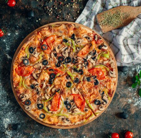 Italian pizza with mushroom, tomato, olive and cheeseの写真素材