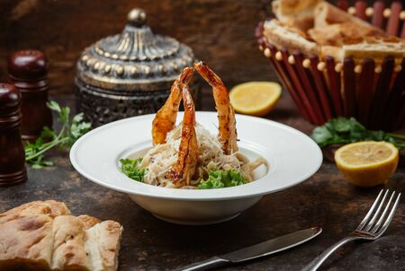 Delicious fettuchini with grilled shrimps and cheeseの写真素材