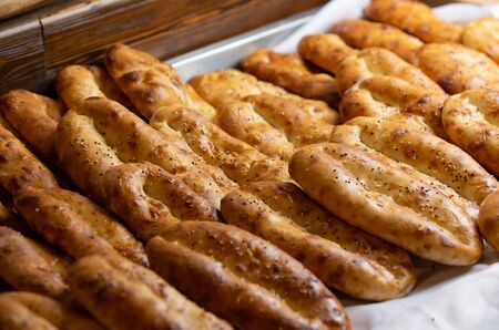 Traditional azerbaijani tandoor breads with sesame seeds on topの写真素材