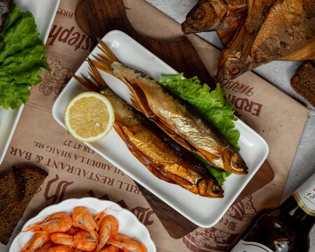 Smoked fish served with lemon 1の写真素材
