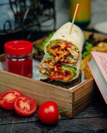 Chicken wrap served with ketchupの写真素材