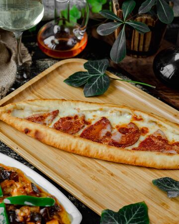 Pide with cheese and sausageの写真素材