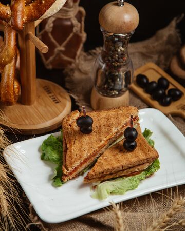 Sandwich topped with olivesの写真素材