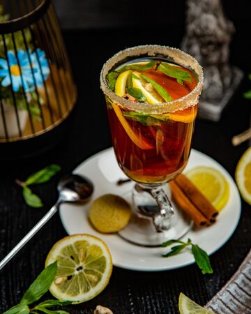 Tequilla anejo filled with lemon and mintの写真素材