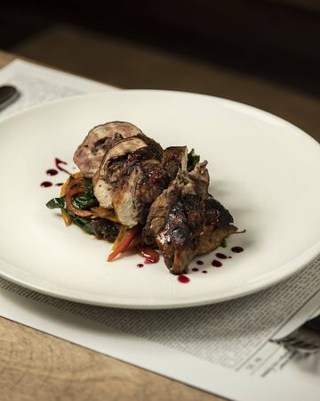 beef wrap served with roasted vegetables, spinach in teriyaki sauceの写真素材