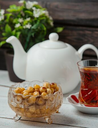 azerbaijani hazelnut jam in crystal bowl served with black teaの写真素材