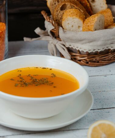 close up of lentil soup in bowl served with breadの写真素材