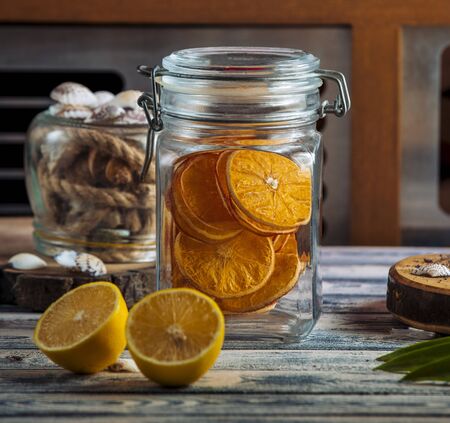 hermetic glass storage jar with dried orange slicesの写真素材