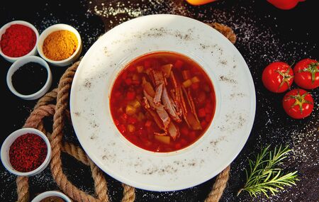 top view of red vegetable soup with beef slicesの写真素材