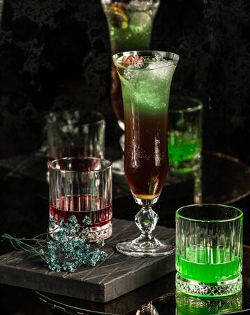 black green cocktail on the tableの写真素材