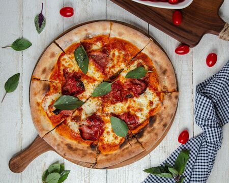 pizza margarita on the tableの写真素材