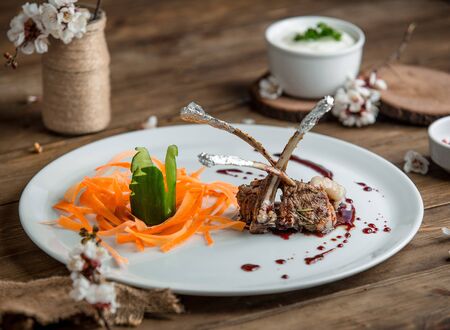 fried meat with vegetablesin the plateの写真素材