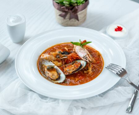 seafood soup on the tableの写真素材