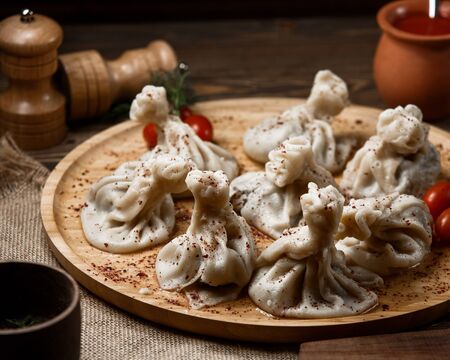 georgian khinkali on wooden boardの写真素材