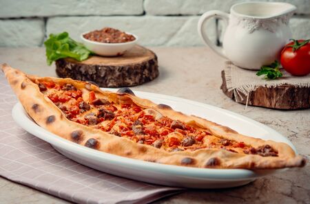 traditional turkish meat pide on the tableの写真素材
