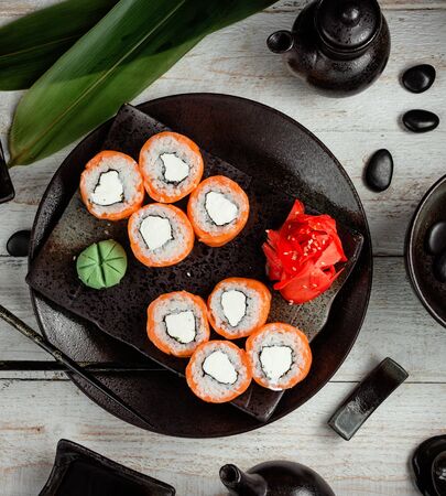 salmon sushi with cream served with ginger and wasabiの写真素材