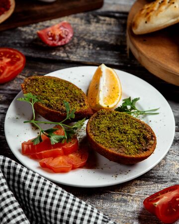 fried cotletes with green on the tableの写真素材