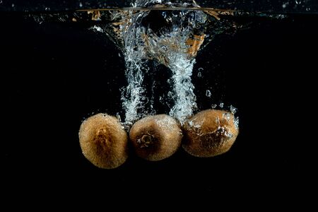 fresh kiwis in the waterの写真素材