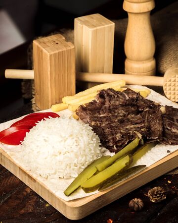 meat slices with rice and picklesの写真素材