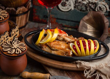 fried chicken with lemon and pomegranateの写真素材