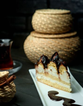 a sponge cake with chocolate syrupの写真素材