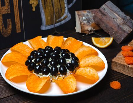 tiffany salad with olives and chipsの写真素材