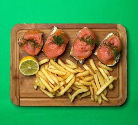 salmon with bread and french friesの写真素材