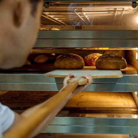 cooked fresh breads in furnaceの写真素材