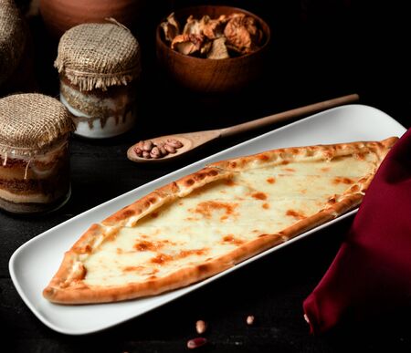 turkish dish pide with grated cheese