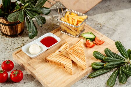 sandwich served with french fries and ketchup