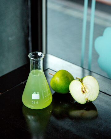 apple juice in medical glassの写真素材