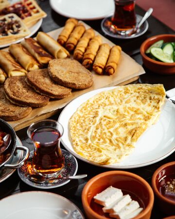 fried eggs with bakery and black teaの写真素材