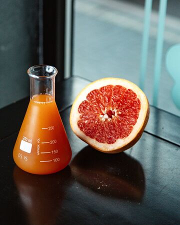 grapefruit and juice in glass
