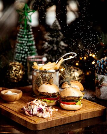 little burgers with herbs on topの写真素材