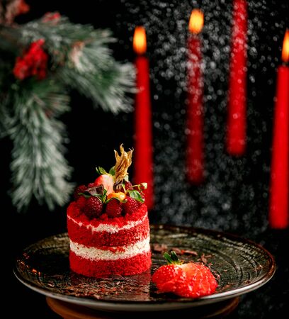 fruit cake with strawberries in the plateの写真素材