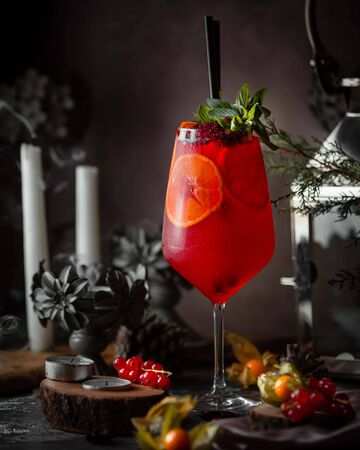 red cranberry cocktail with lemon sliceの写真素材