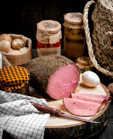 thinly sliced lamb meat on a wooden frothの写真素材