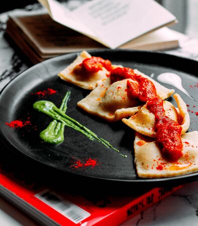 bakery on pan with tomato sauce