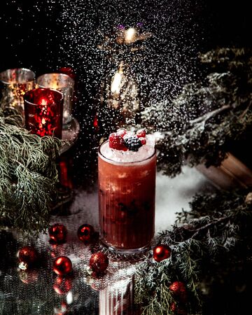 berry juice  with ice and berries on topの写真素材