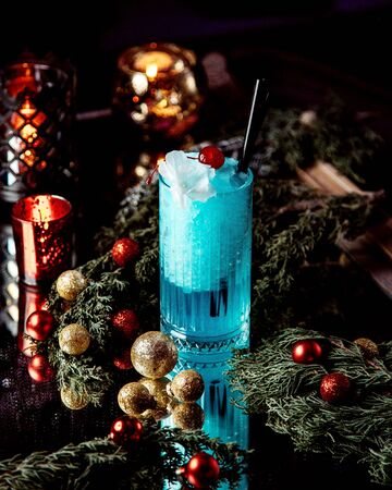 blue beverage with whipped cream on topの写真素材
