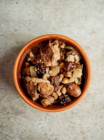 boiled meat with vegetables in potの写真素材
